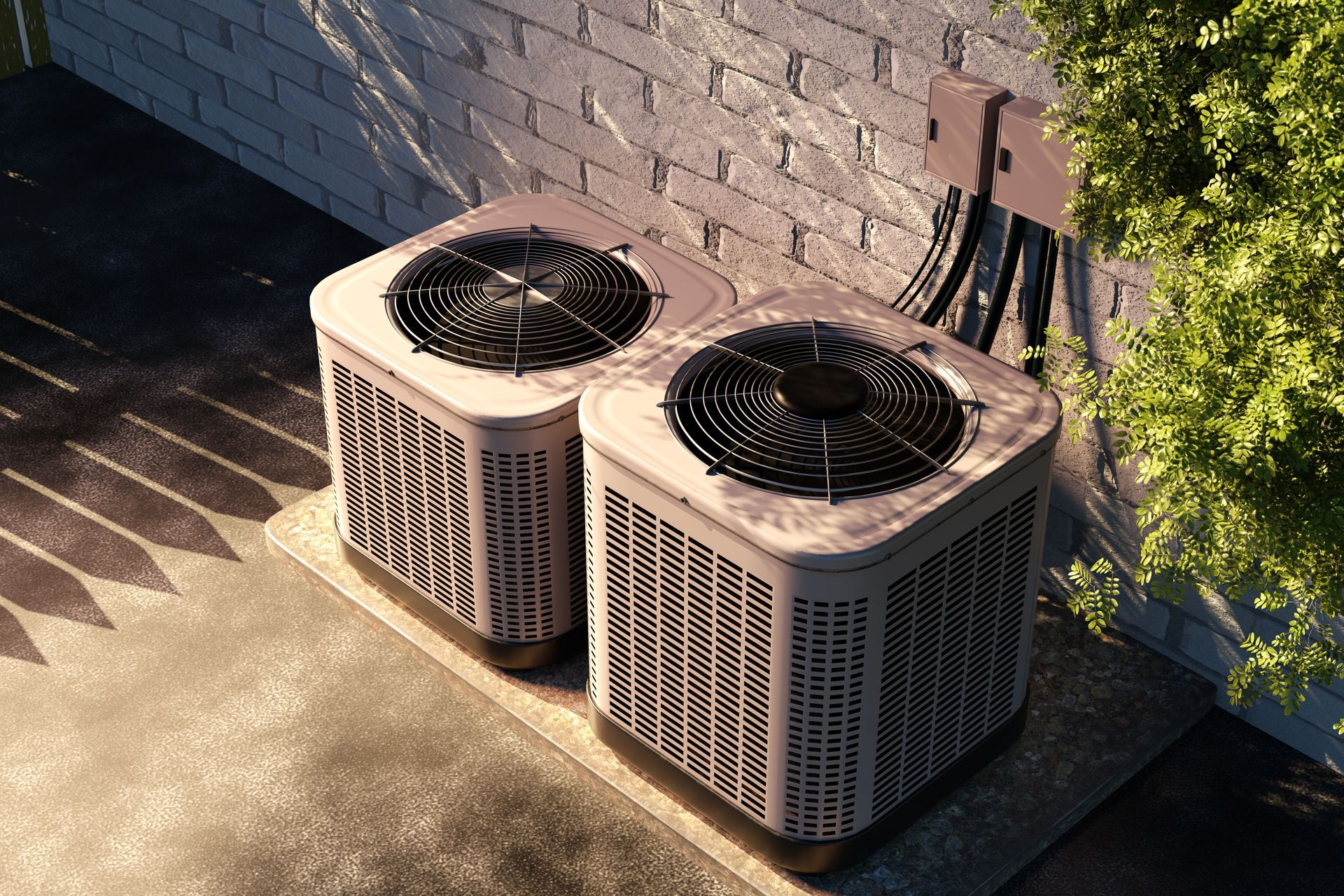 Two outdoor air conditioner units beside a brick wall on a concrete patio Two outdoor air conditioner units beside a brick wall on a concrete patio