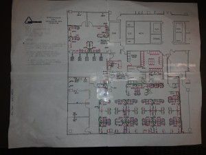 A floor plan of a building on a piece of paper.
