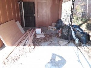 There is a lot of trash in the garage.