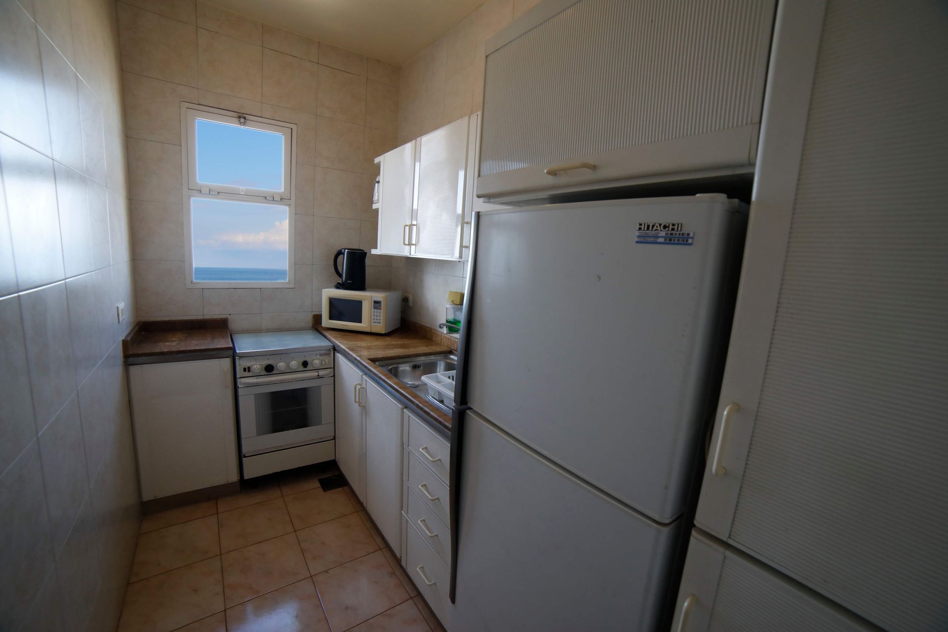 A kitchen with a refrigerator that says ' lg ' on it
