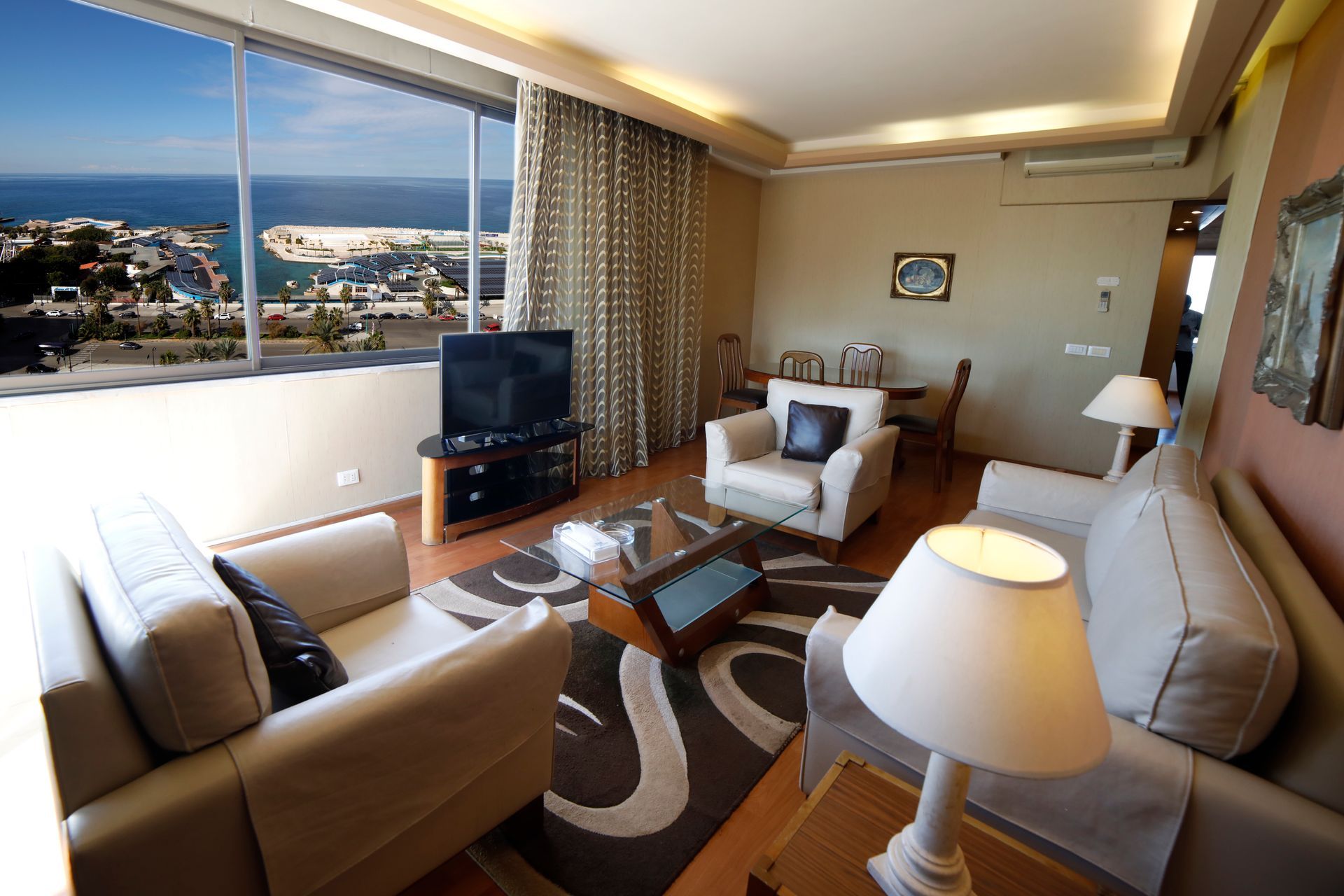 A living room with a view of the ocean