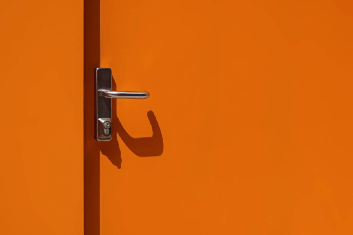 Orange metal door with a fresh coat of paint near Bourbonnais, Illinois (IL)