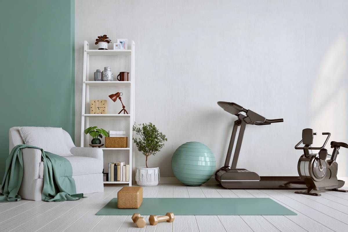 A home gym with green accent wall and exercise equipment at John Paul's Paint & Decor near Bourbonnais, Illinois
