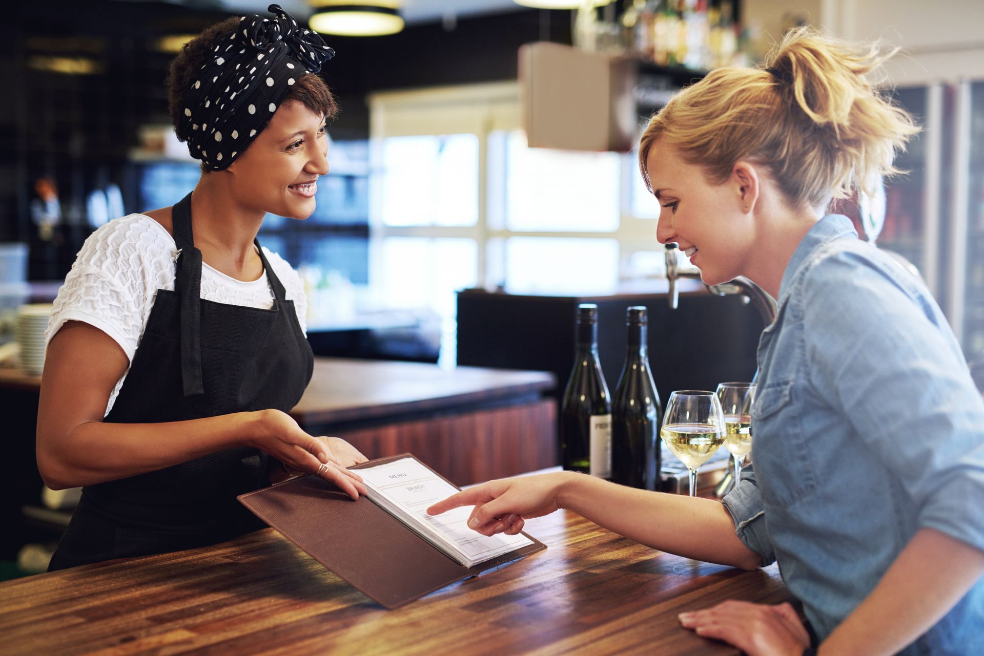 Customer looking at a restaurant menu