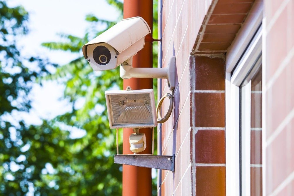 A Security Camera and Spotlight Mounted on a Brick — McGrath Electrical & Data in Evans Head, NSW