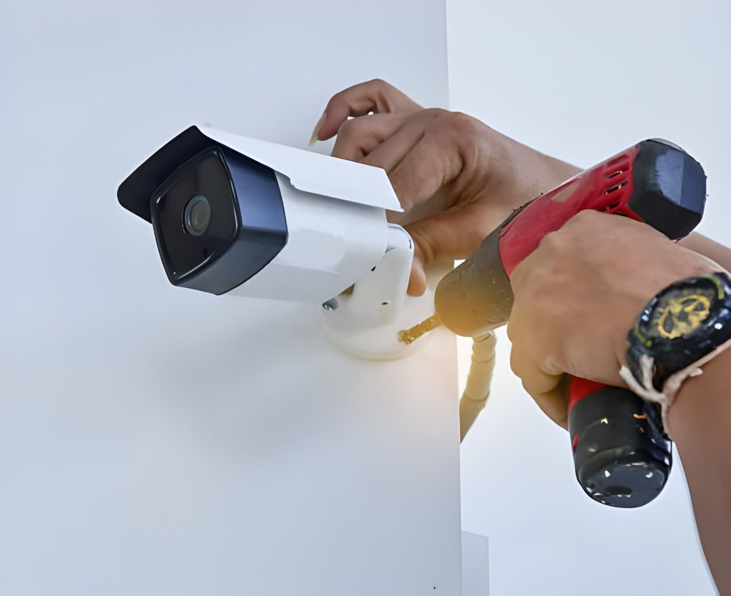 A Person is Installing a Security Camera — McGrath Electrical & Data in South Grafton, NSW
