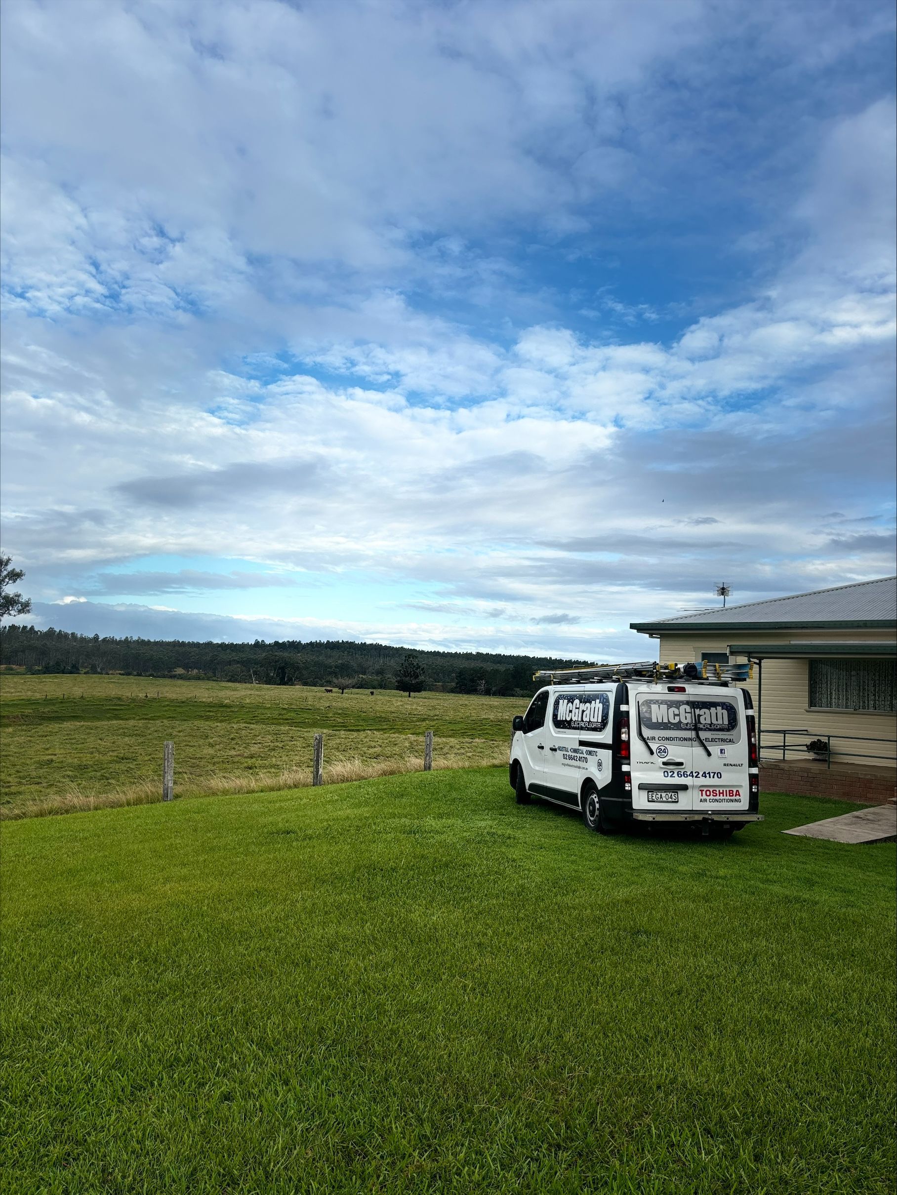 A van is parked outside of a house while on a front lawn — McGrath Electrical & Data in South Grafton, NSW 