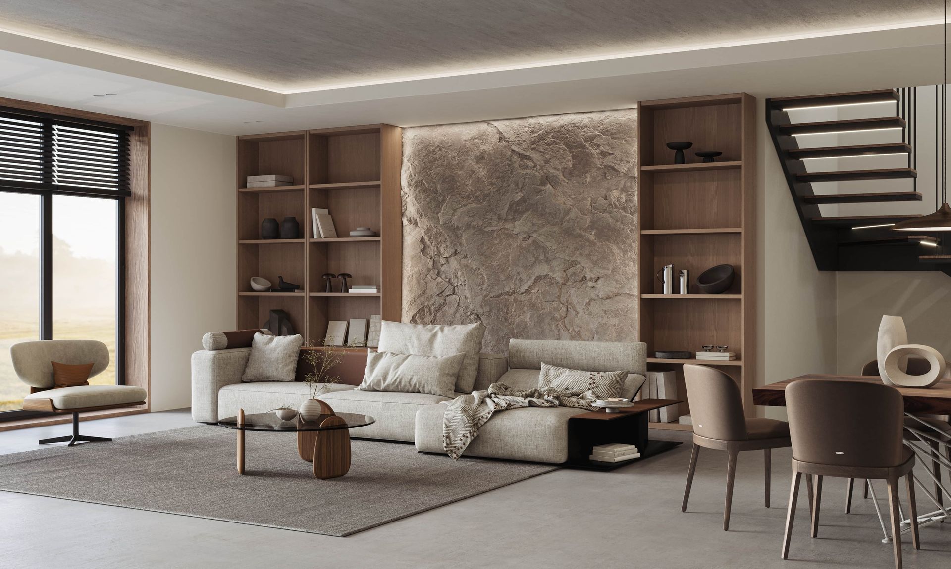 Modern neutral living room with beige sofa, shelving, stone wall, staircase, and dining area