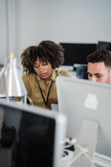 Operations consultant reviewing workflow data in modern medical office
