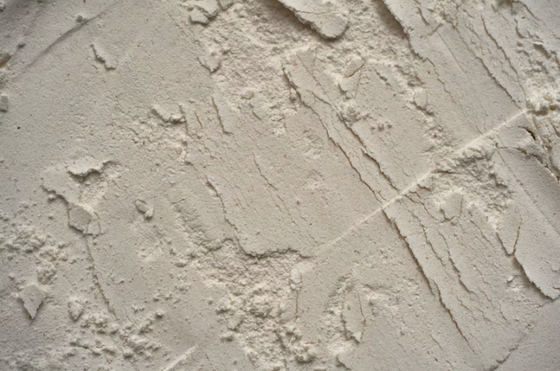 Close-up of textured drywall compound showing a rough decorative finish by a drywall contractor in San Tan Valley, AZ