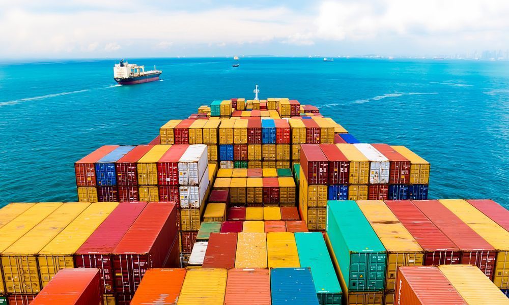 Lot of shipping containers on a dock over the water