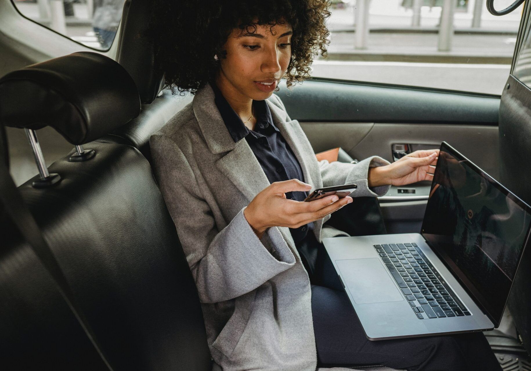 Woman In The Car With Laptop — Boonsboro, MD — Sing-Distinctive Limousine Services LLC