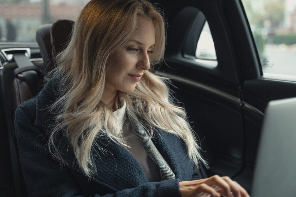 Woman In The Car Smiling — Boonsboro, MD — Sing-Distinctive Limousine Services LLC