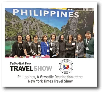 Philippines tourism booth at New York Times Travel Show with seven people posing in front of a mountain backdrop