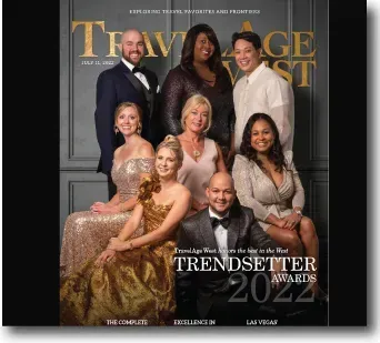 Cover of TravelHost magazine featuring nine smiling award recipients in formal attire on a black background.
