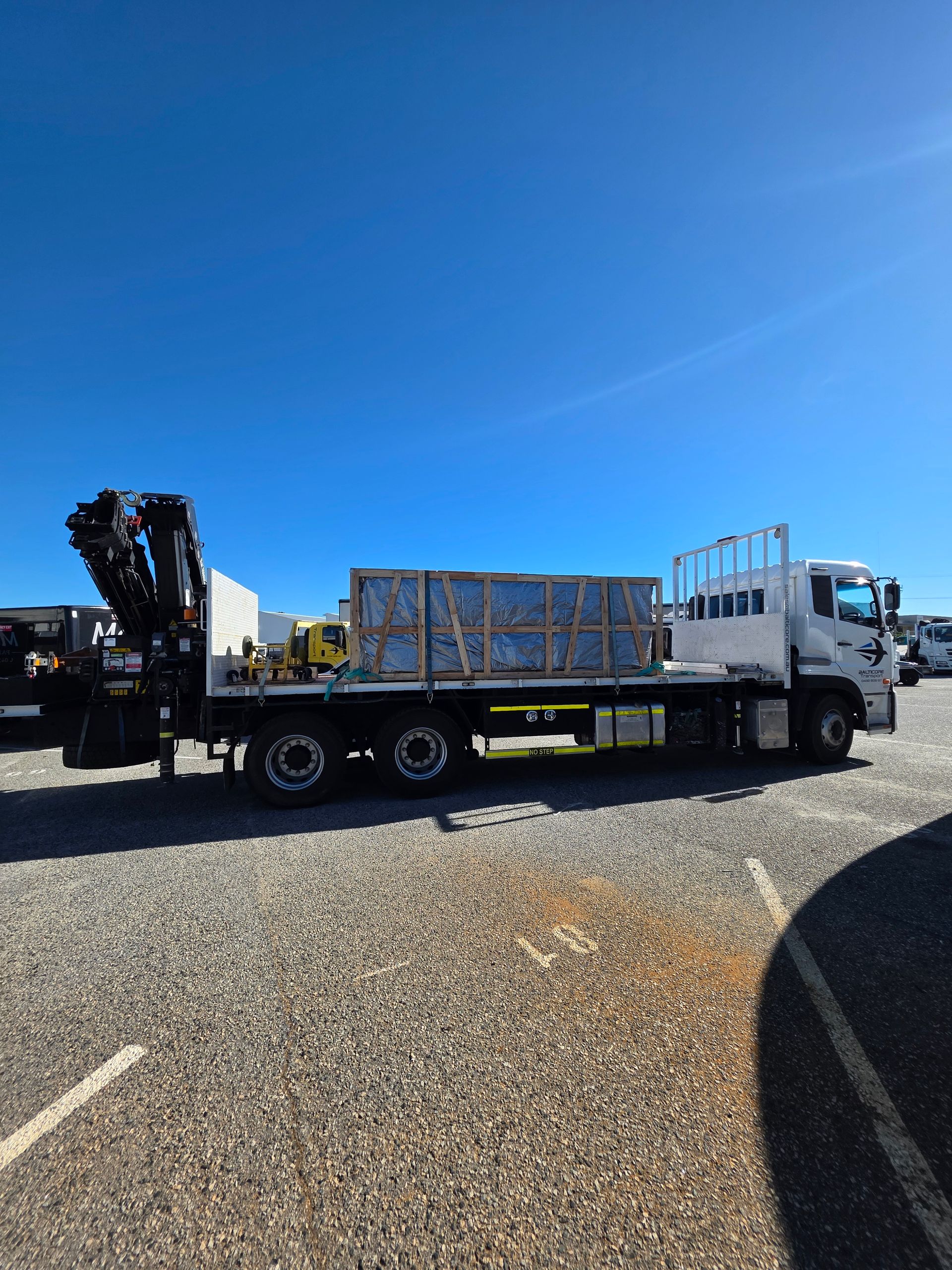 Crated spa on a Balticore Hiab tray at the yard in Perth