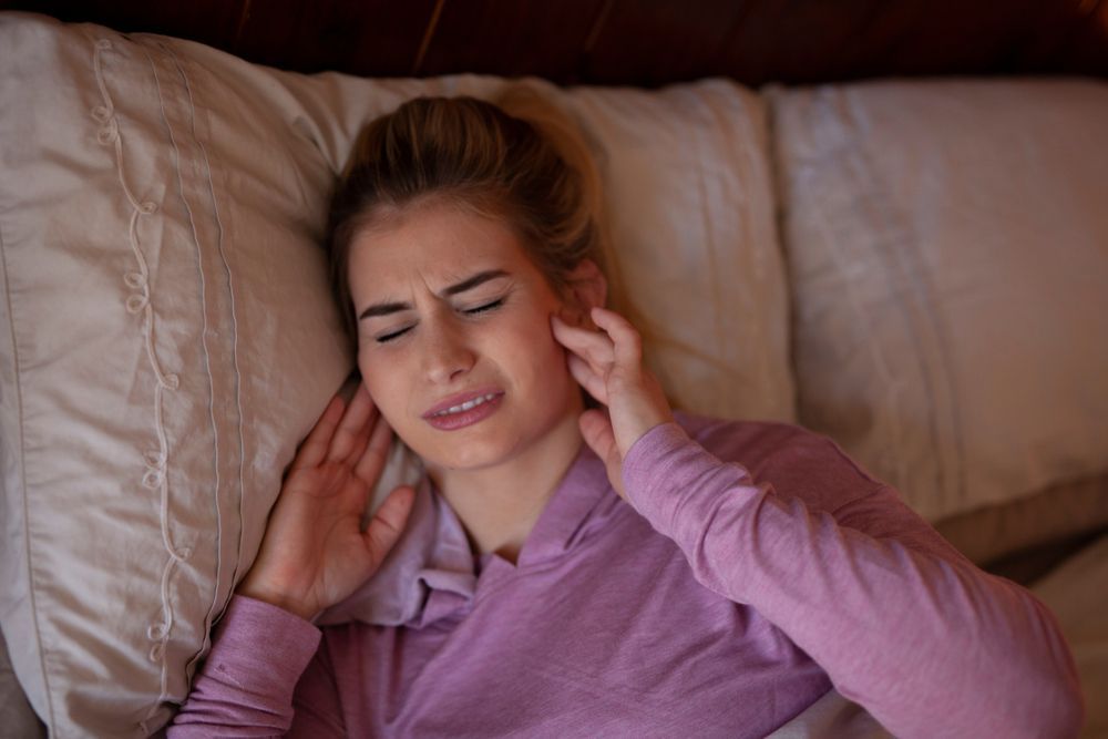 A Person Lying in Bed, Eyes Closed — Killara Dental in East Killara, NSW