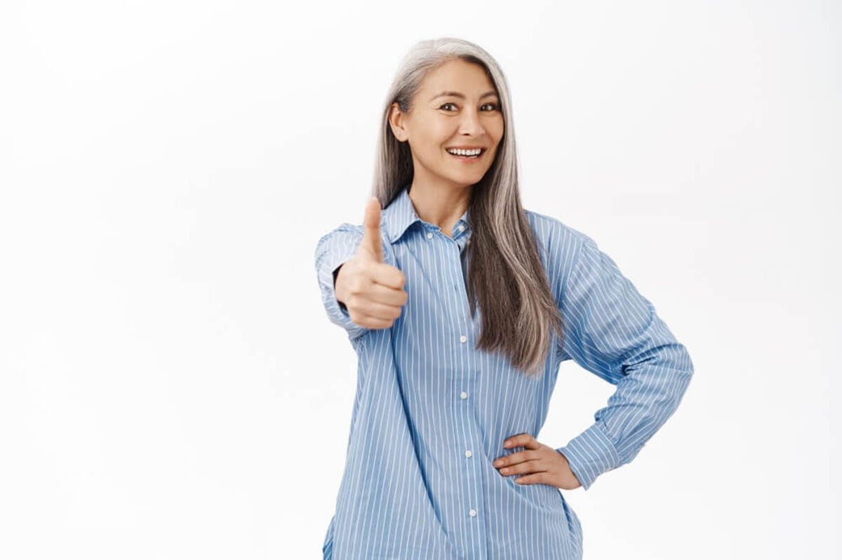 A Smiling Person With Long Grey Hair — Killara Dental in East Killara, NSW