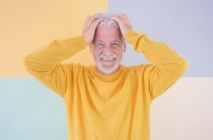 A Smiling Person Wearing a Yellow Sweater — Killara Dental in East Killara, NSW