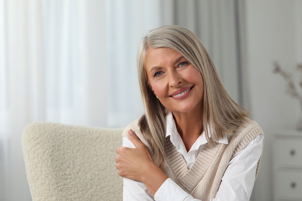 A Smiling Person With Long Grey Hair — Killara Dental in East Killara, NSW