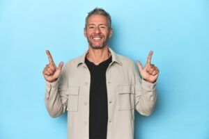 A Smiling Person in a Light Beige Overshirt and Black T-shirt — Killara Dental in East Killara, NSW