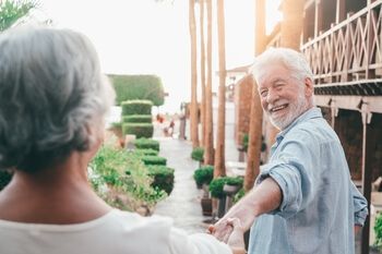 A Smiling Person Holding Hands With Another Individual — Killara Dental in East Killara, NSW