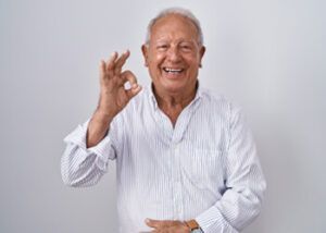 A Smiling Person in a Light-colored, Striped Button-down Shirt — Killara Dental in East Killara, NSW