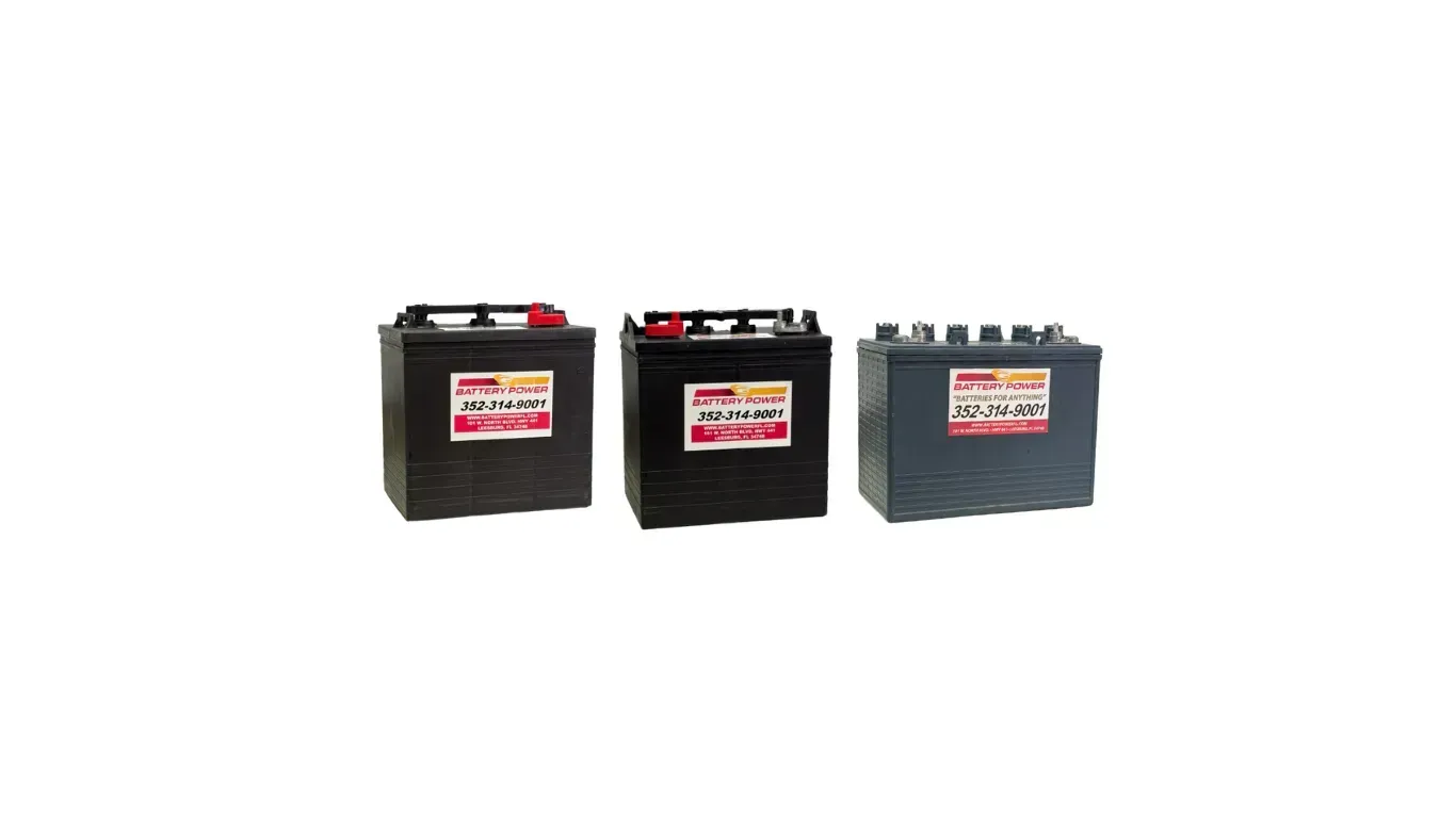 Three black automotive batteries with red and white labels on a white background