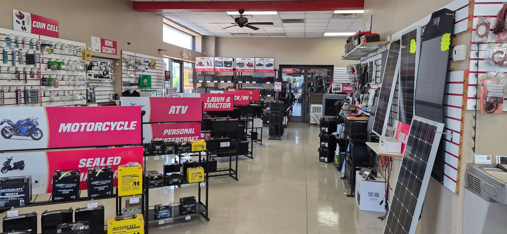 Auto parts store aisle with motorcycles and red sale signs