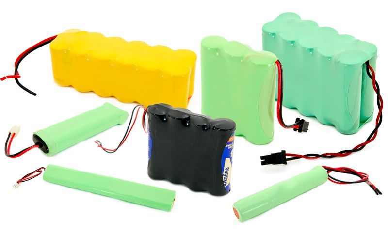 Battery packs displayed on a store shelf with price tags and boxes in the background