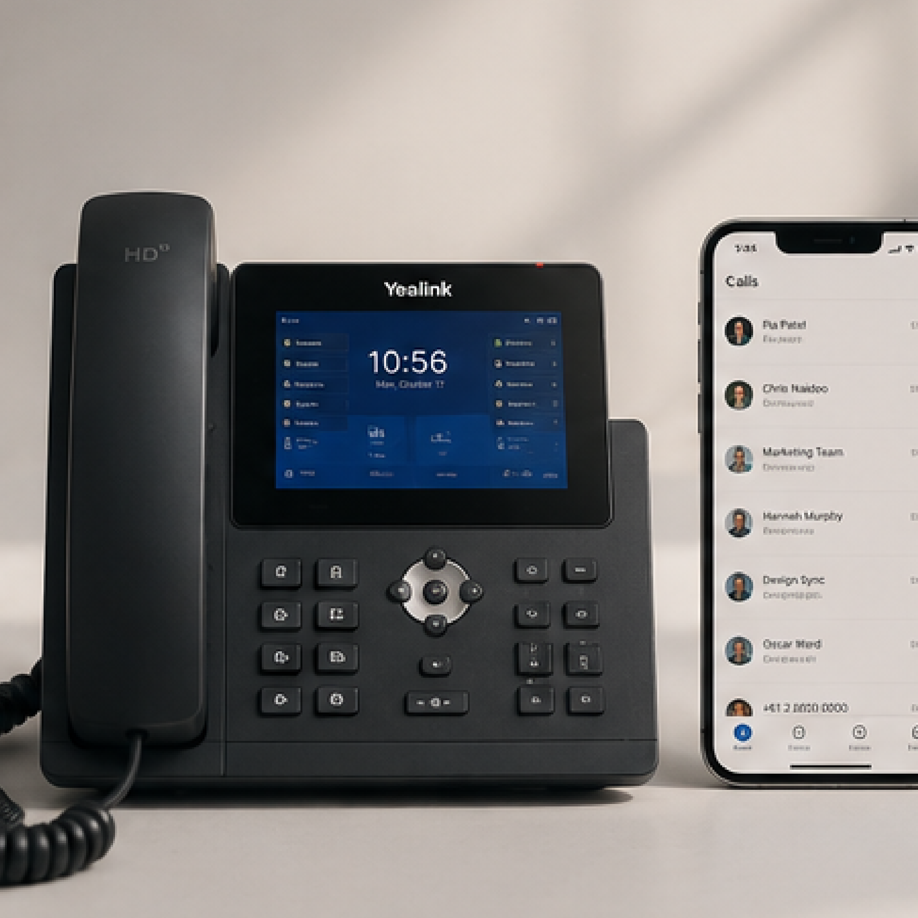 Desk phone with touchscreen and keypad beside a smartphone displaying a contacts list