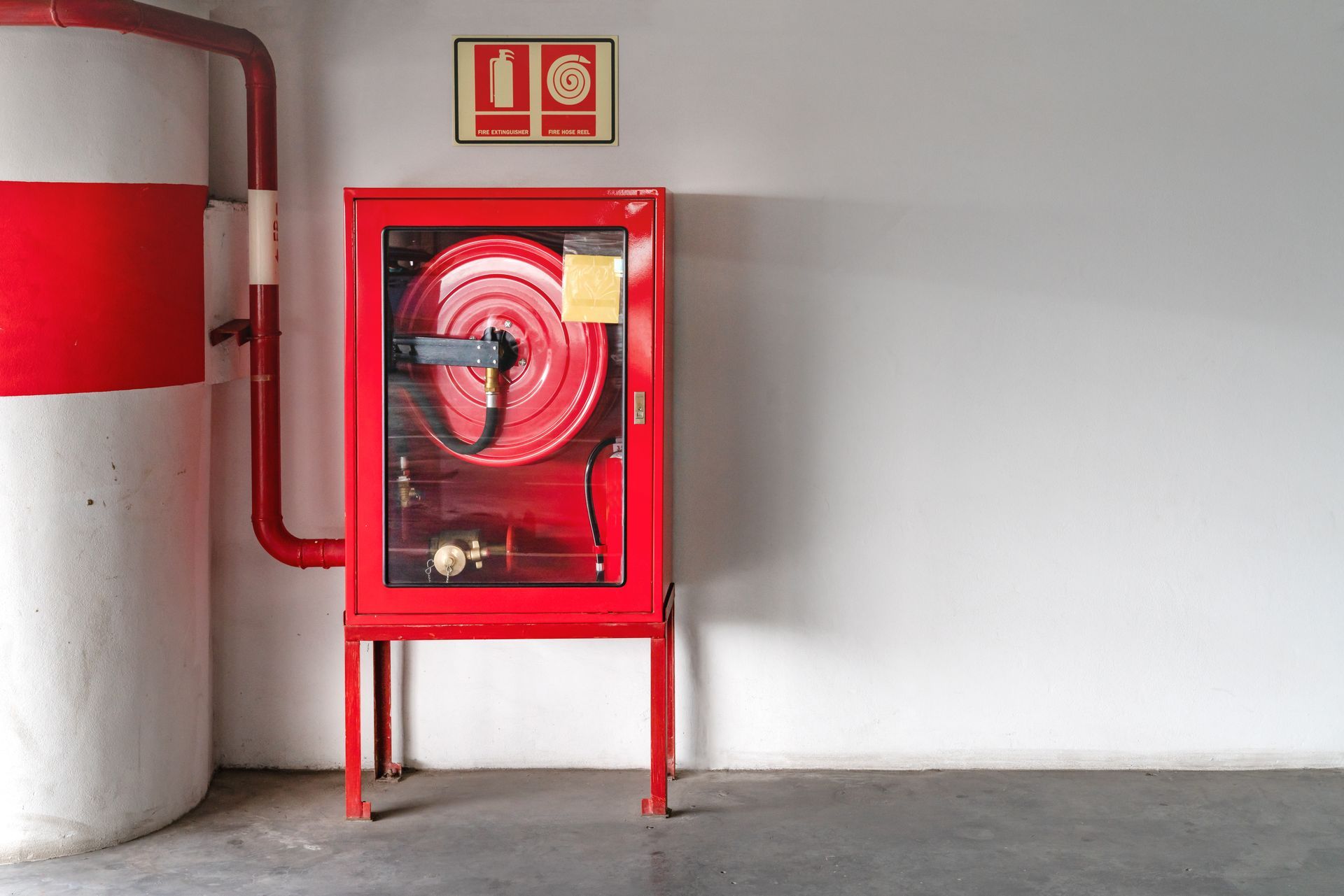 Fire alarm switch on the wall in factory.