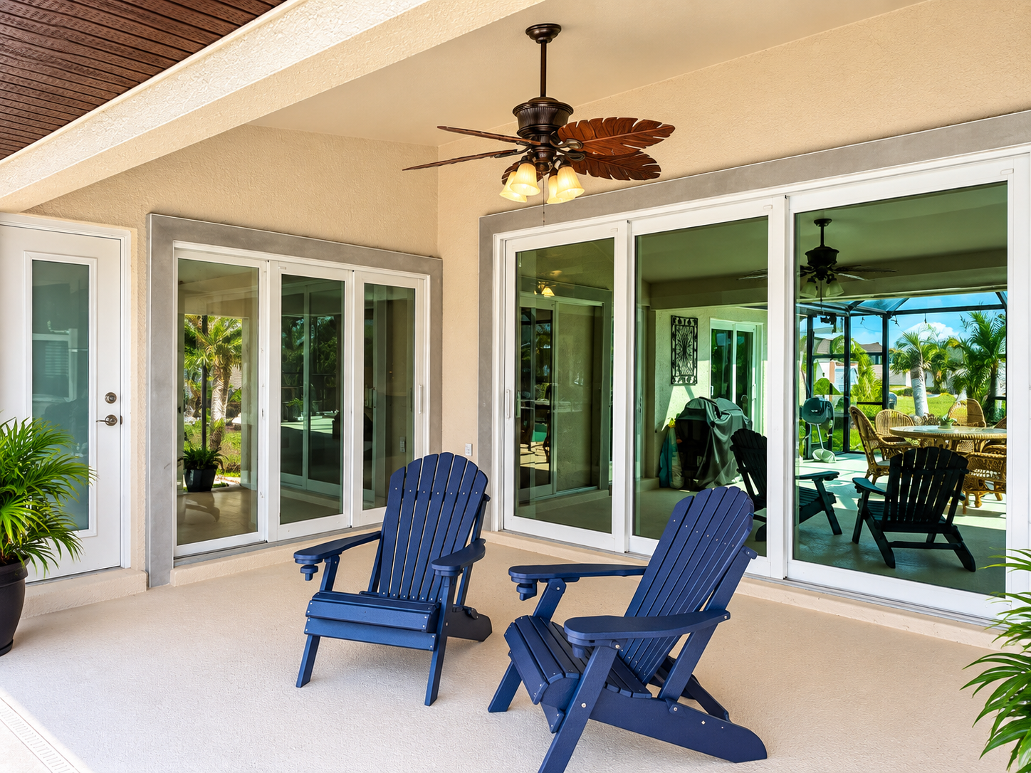 White-framed sliding glass doors installed on a covered patio in Cape Coral, FL