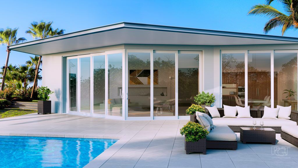 Modern home with a pool, patio, and sliding glass doors. Palm trees, blue sky, and outdoor furniture.