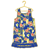 Blue floral sleeveless dress hanging on a yellow hanger, with “THE BATA PROJECT” at the hem