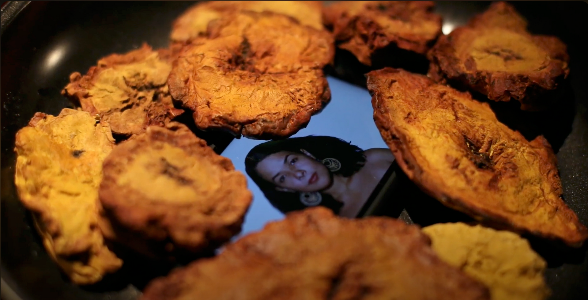 a pan of food with a picture of a woman on it