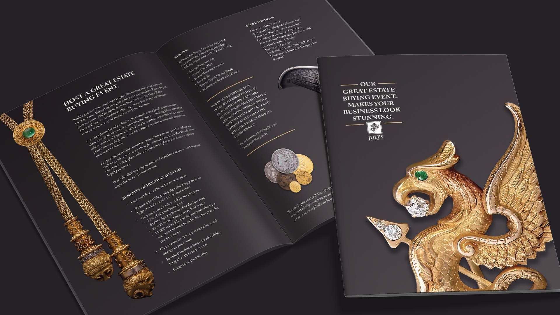 Open jewelry catalog with gold necklace and ornate peacock design on black pages