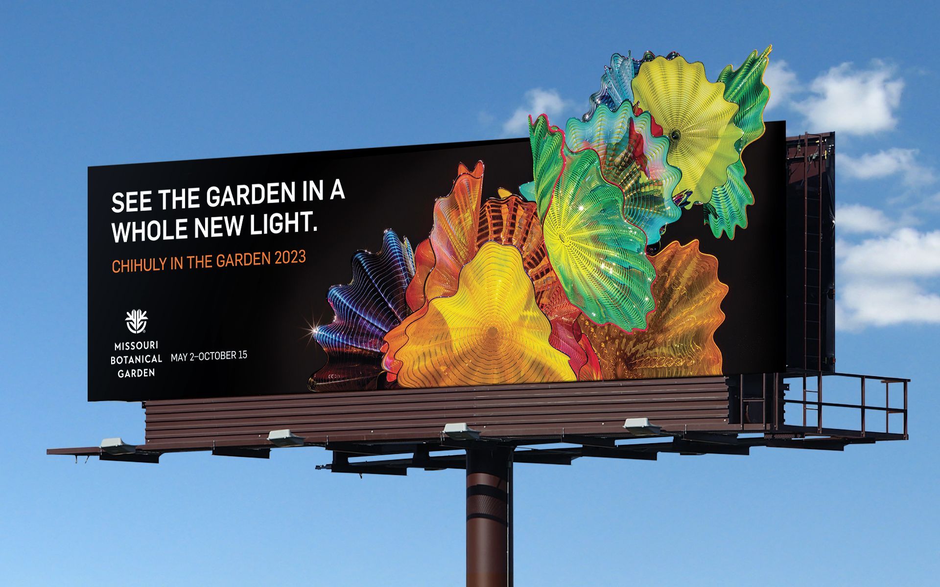 A billboard for the Missouri Botanical Garden that says see the garden in a whole new light