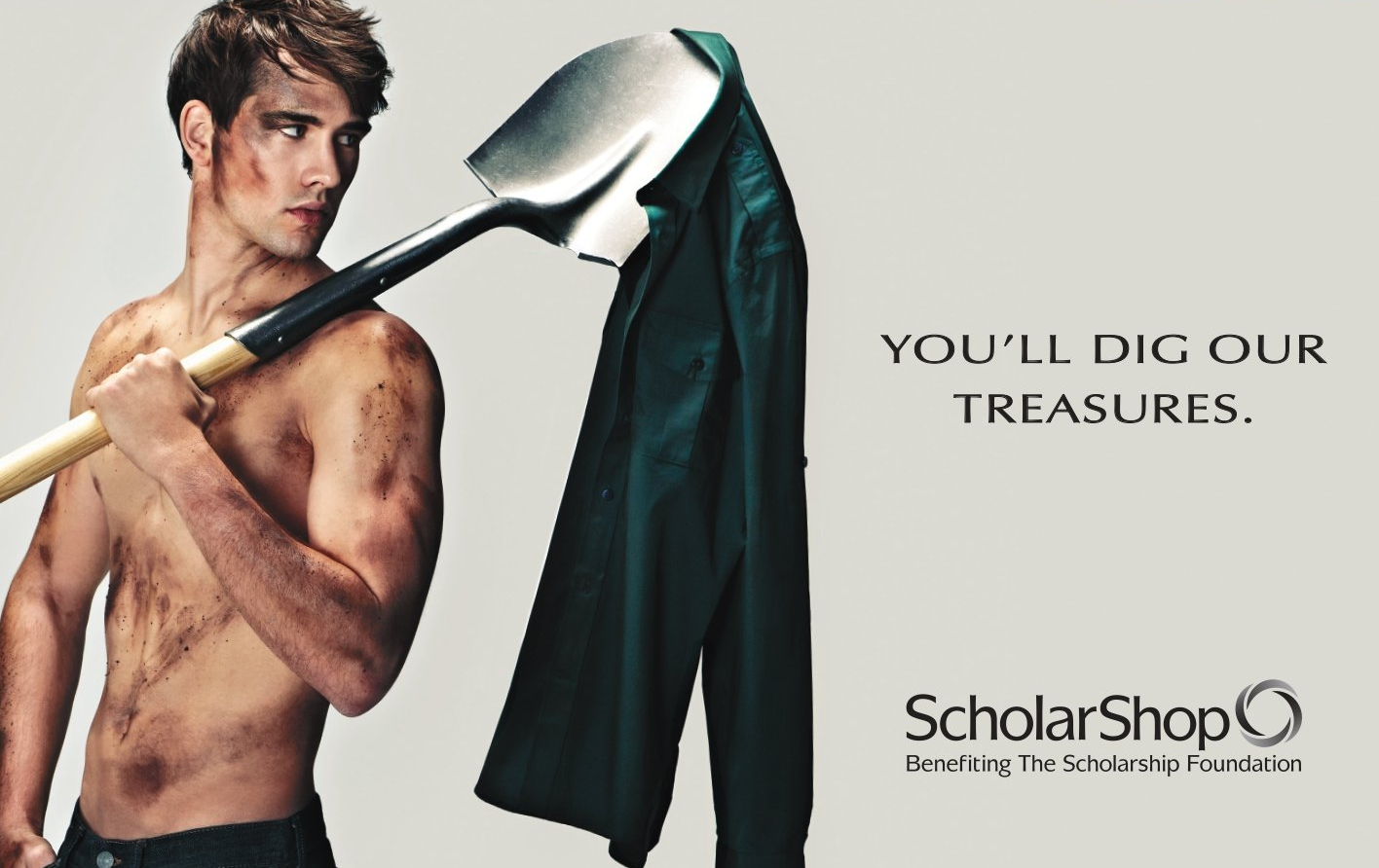 A shirtless man is holding a shovel over his shoulder in an advertisement for scholar shop
