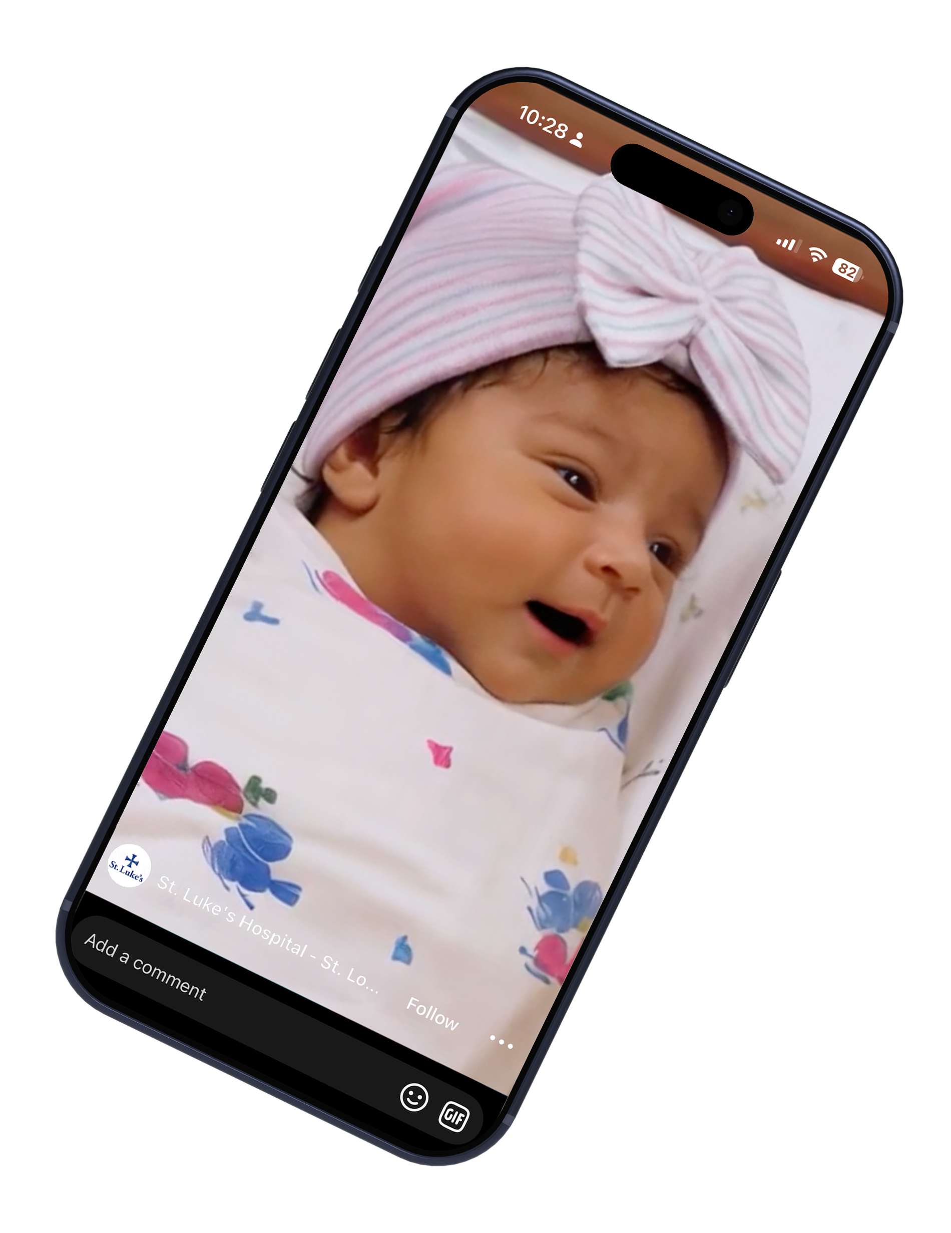 Smartphone displaying a baby wearing a pink bow headband and floral outfit on screen