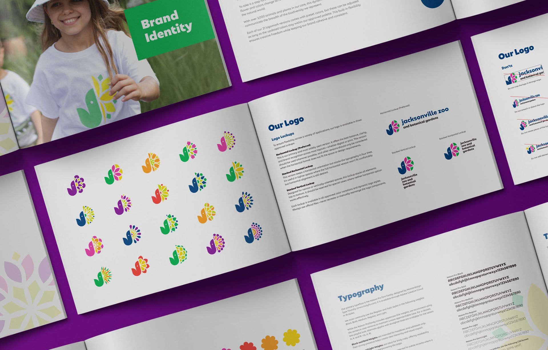 Brand identity brochure spread with colorful logo patterns and design layouts on purple background