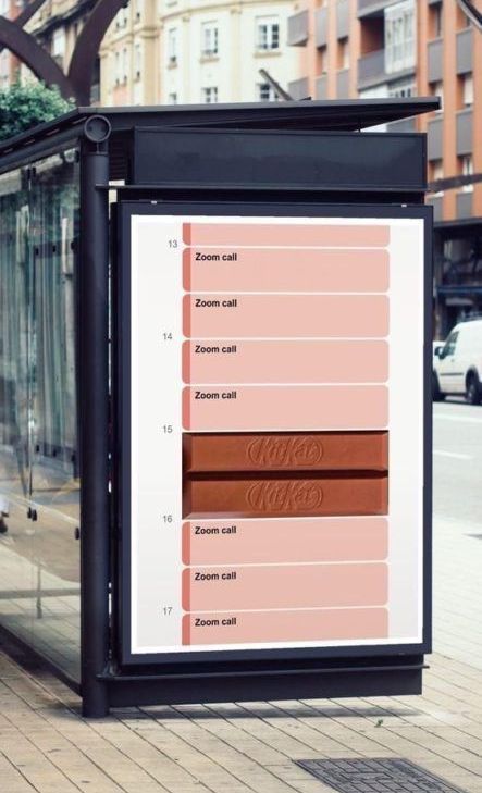 A bus stop with a large poster on it that says ' afternoon ' on it