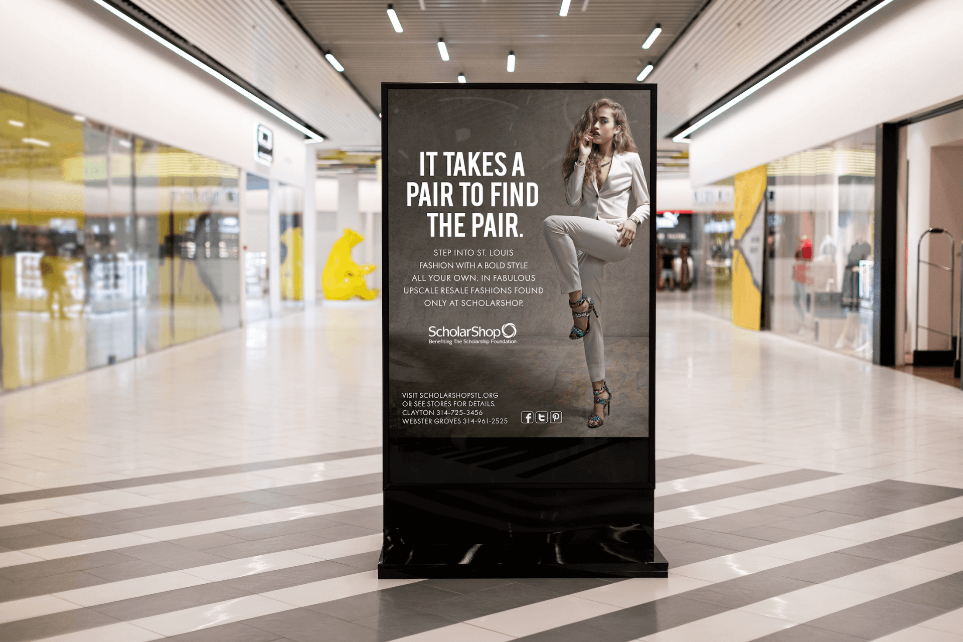 A billboard in a mall that says `` it takes a pair to find the pair ''