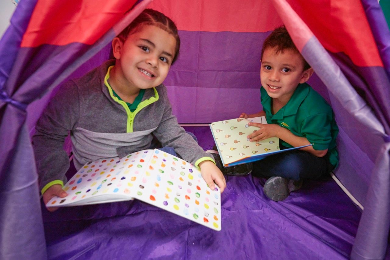 students reading at School in the Square bilingual early childhood center