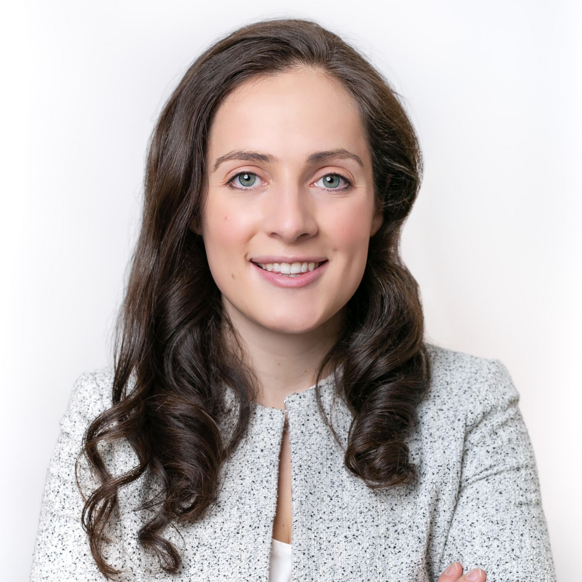 Mary Fasano in a light gray jacket against a white background