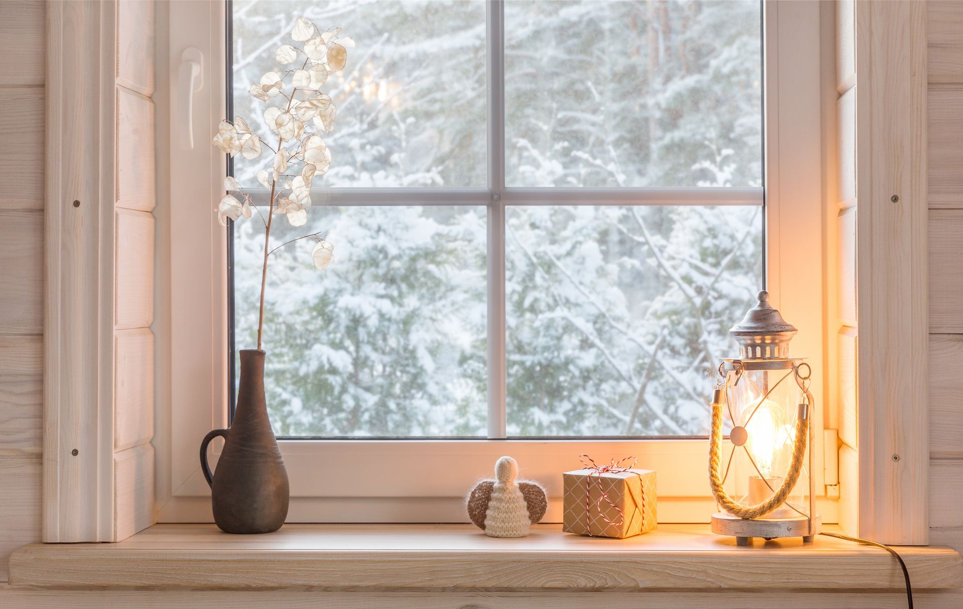 A rustic window with a view of the winter