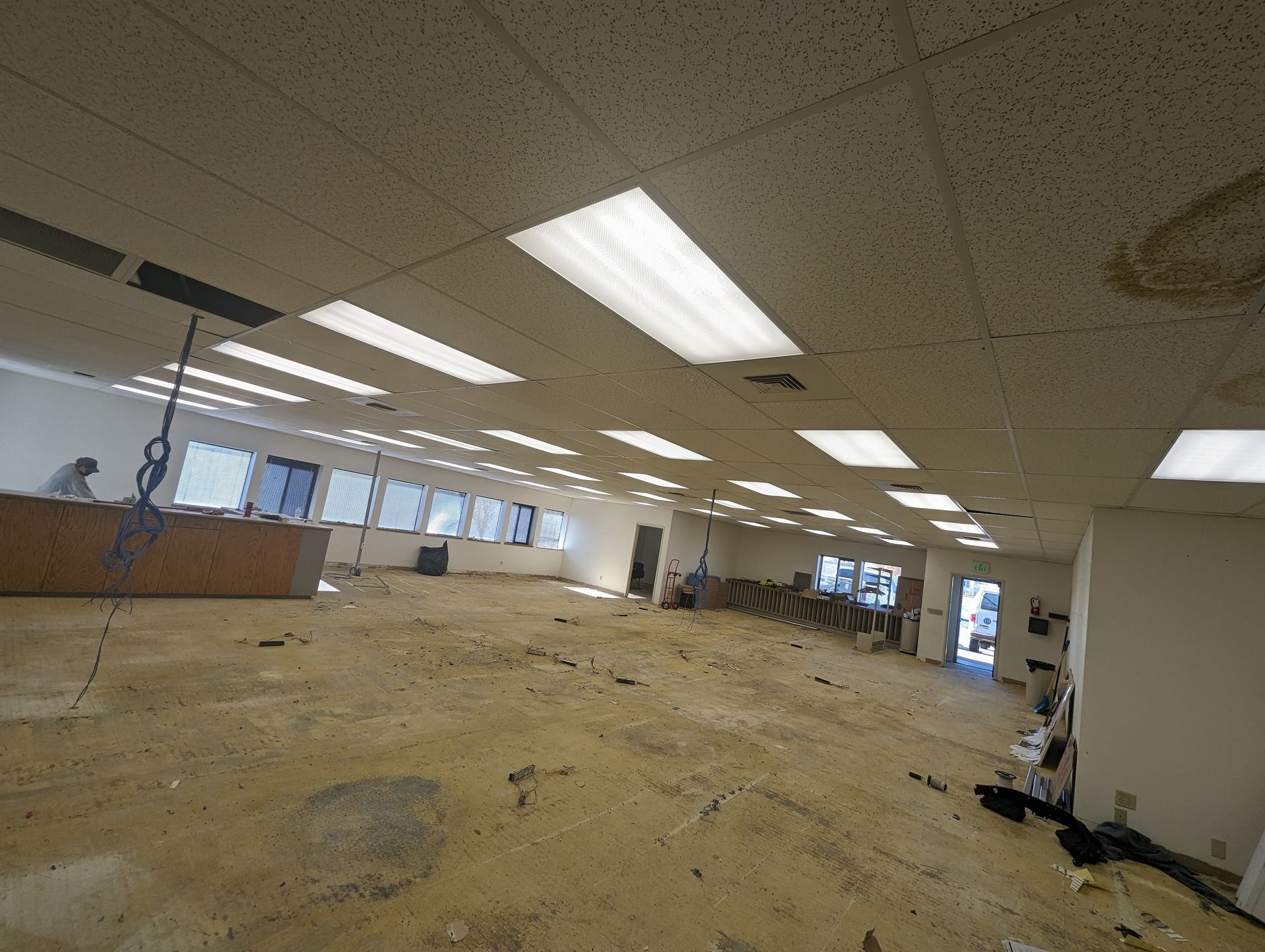 A large room with a lot of lights on the ceiling