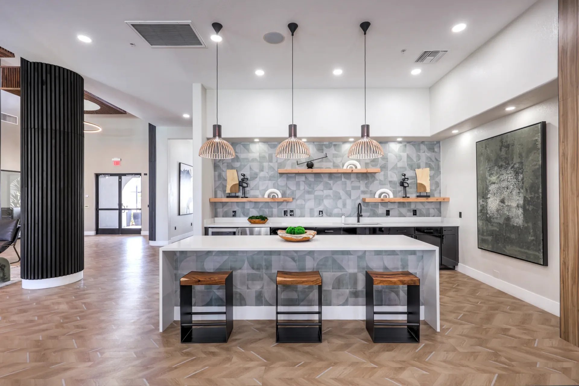 Modern community kitchen with island and bar stools at Cornerstone Park in Henderson, NV.