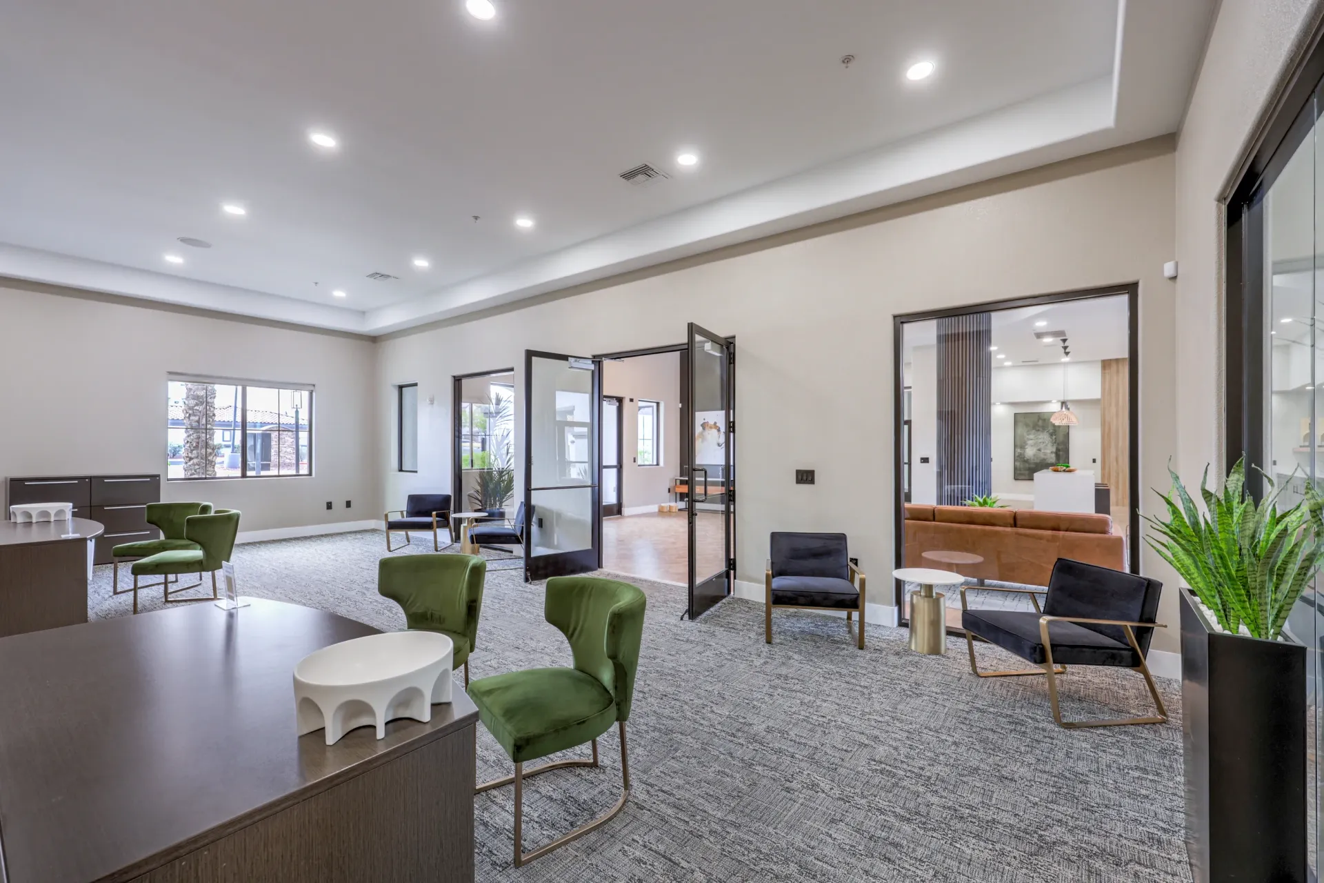 Interior view of the apartment community lounge area with modern furniture and ample lighting at Cornerstone Park in Henderson, NV.