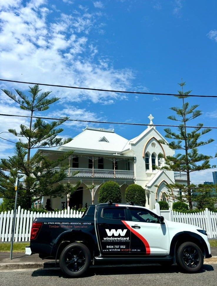 Window Wizard Restoration ute parked outside a restored Queenslander home in Brisbane